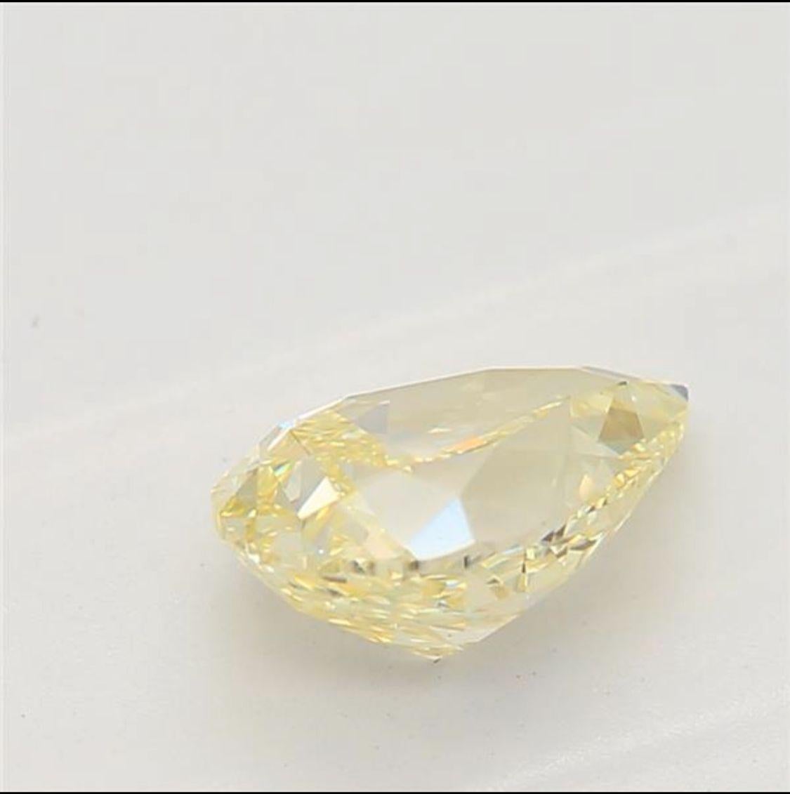 Pear Cut 0.59 Carat Fancy Light Yellow Pear cut diamond VVS1 Clarity GIA Certified For Sale
