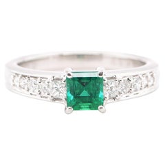 0.59 Carat Natural Emerald and Diamond Engagement Ring Set in Platinum