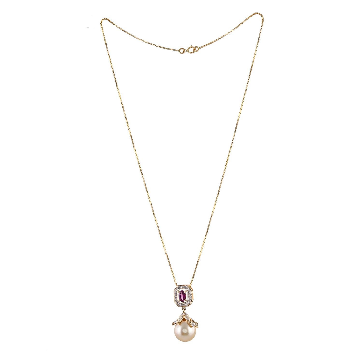 0.59ct Purple garnet oval is the hero of this classic pendant. Diamond elements on this cap with a total diamond weight of 0.54 carats of top quality Australian 12mm south sea pearl drop weighing 12.06ct are great to glam up your outfit. Handcrafted