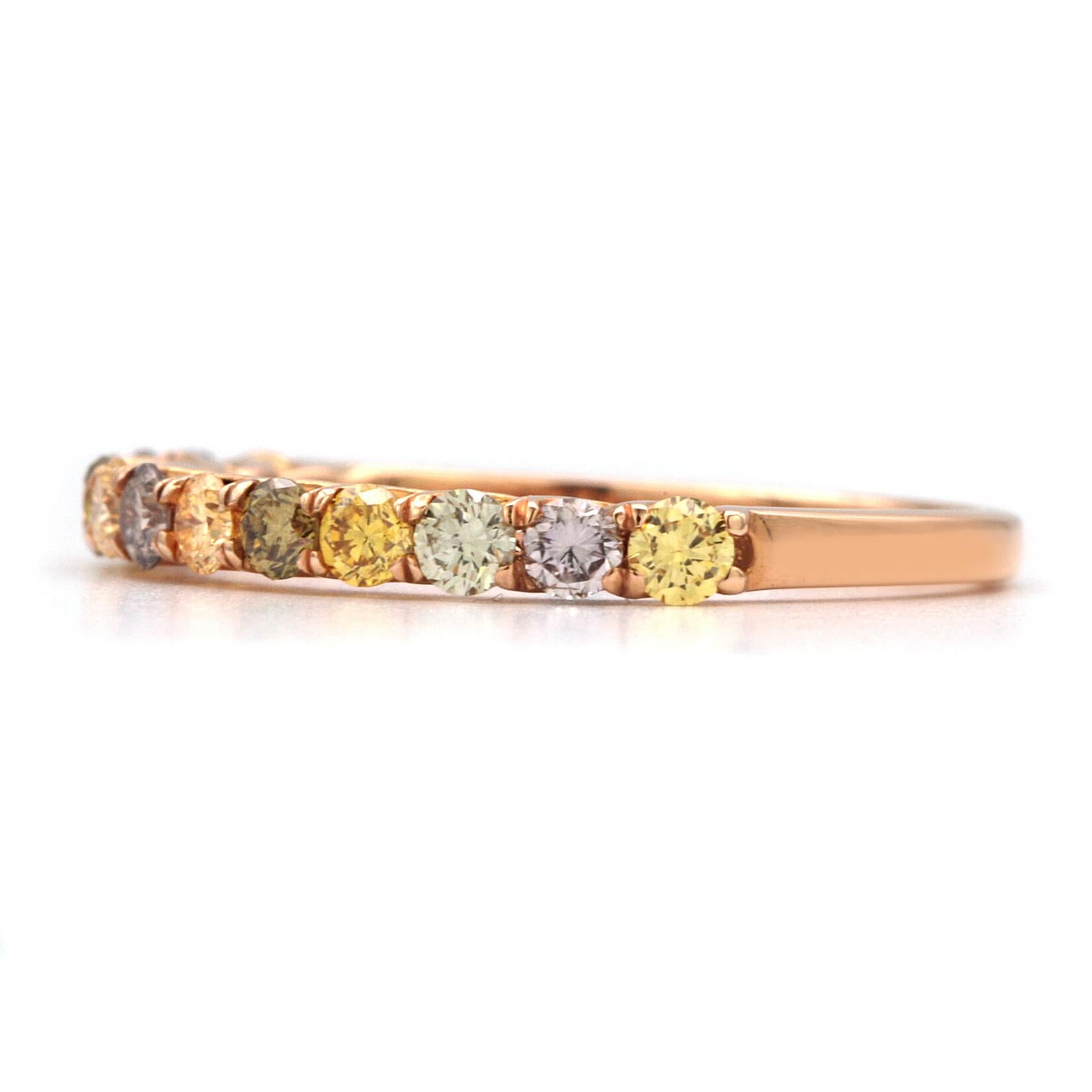 This beautiful and modern ring has 13 Natural Multicolored Diamonds giving it a total carat weight of 0.59ct. Four are Intense Yellow, 3 are Fancy Purplish Pink, 2 are Fancy Yellowish Green, and 4 are White.
Clarity is approx. I1.
Stamped 