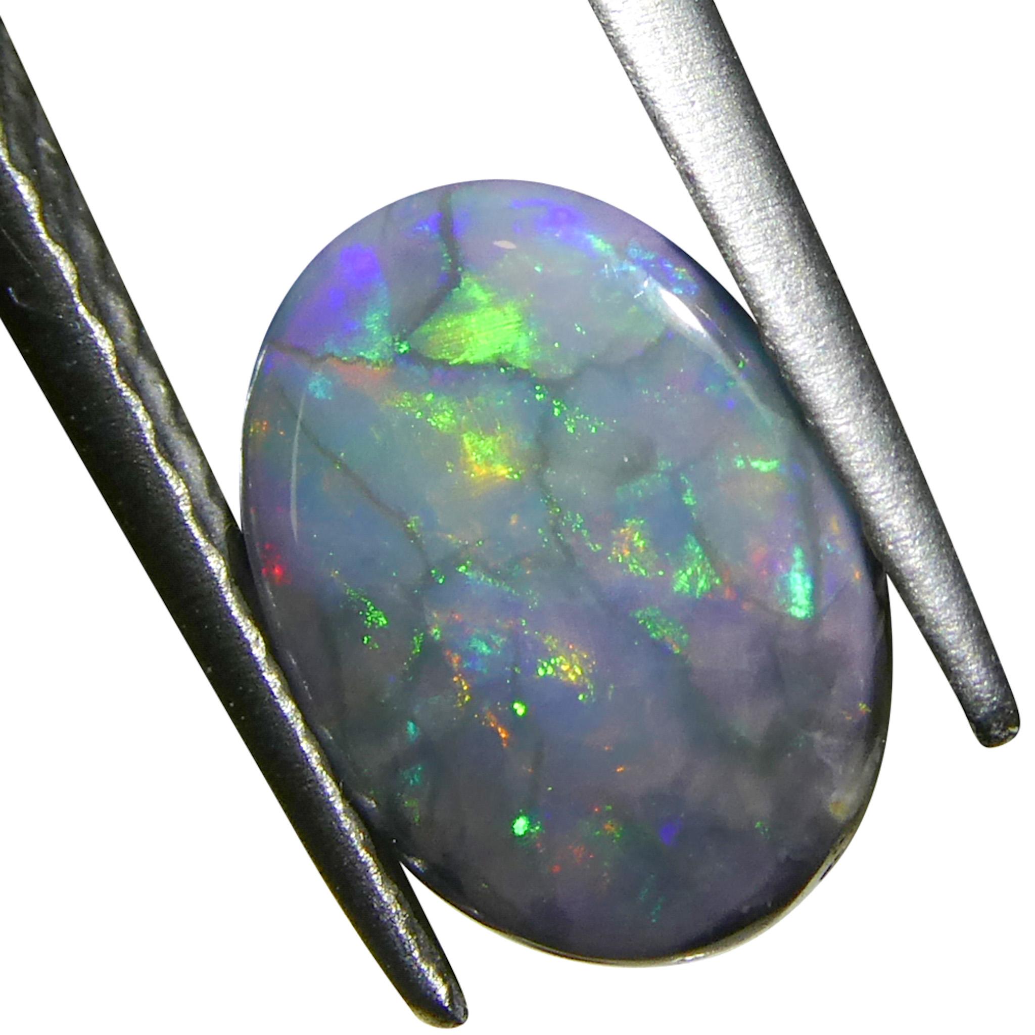 Taglio ovale 0.59ct Opale grigio ovale cabochon dall'Australia in vendita