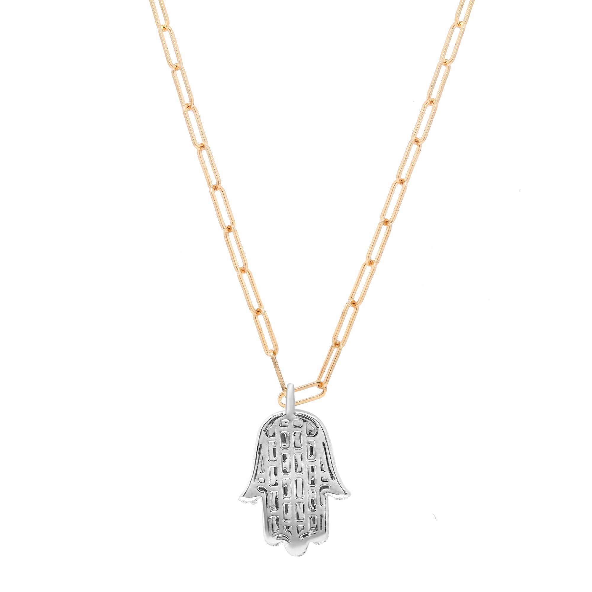 This majestic Hamsa pendant necklace features prong set Baguette cut diamonds with an outline of round brilliant cut diamonds. Total diamond weight: 0.59 carat. The pendant is crafted in 14K white gold and the paperclip link chain comes in 14K