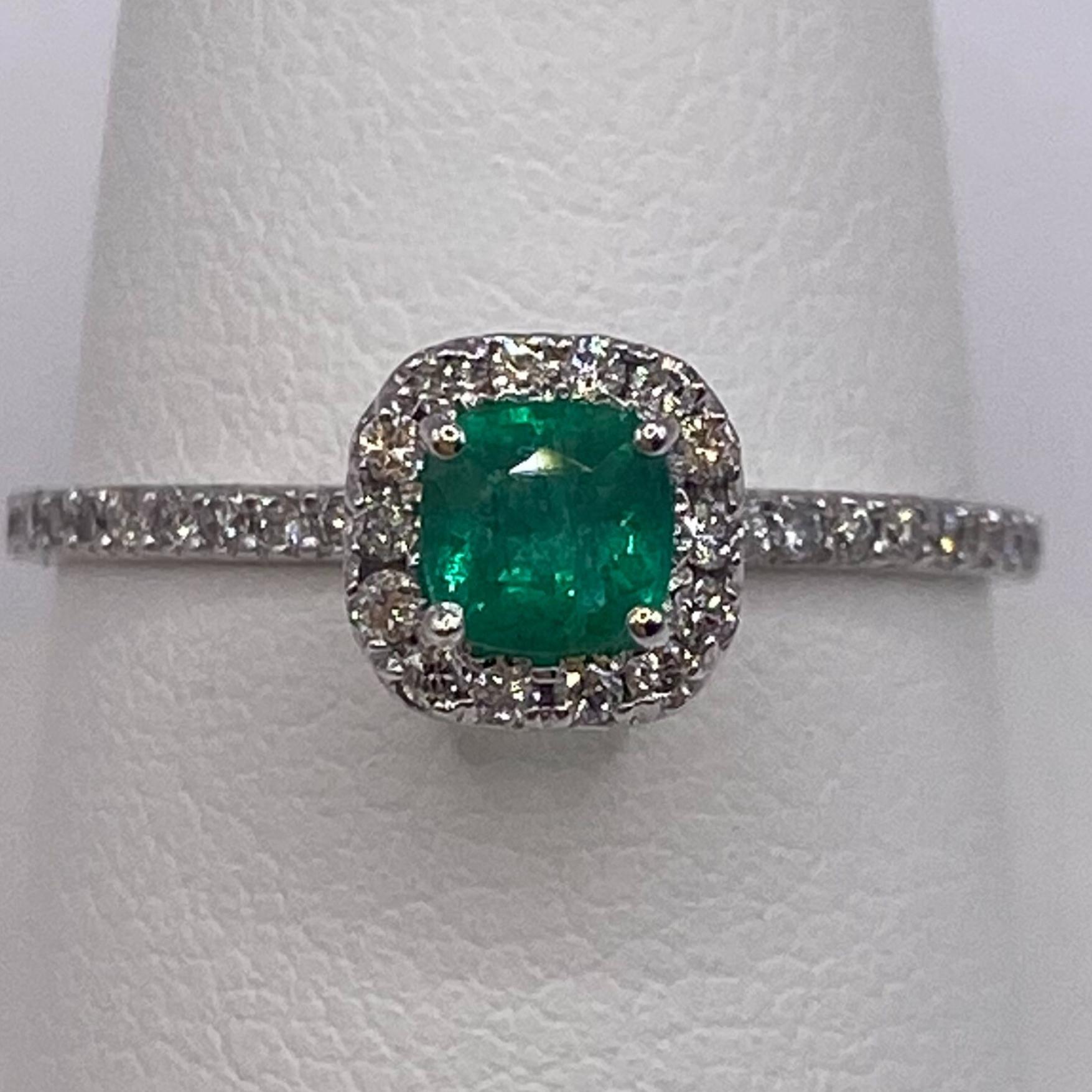 Metal: 14KT White Gold
Finger Size: 6.75
Band Width: 1.4mm

(Ring is size 6.75, but is sizable upon request)

Number of Cushion Cut Emeralds: 1
Carat Weight: 0.35ctw
Stone Size: 4.15mm

Number of Diamonds: 38
Carat Weight: 0.24ctw