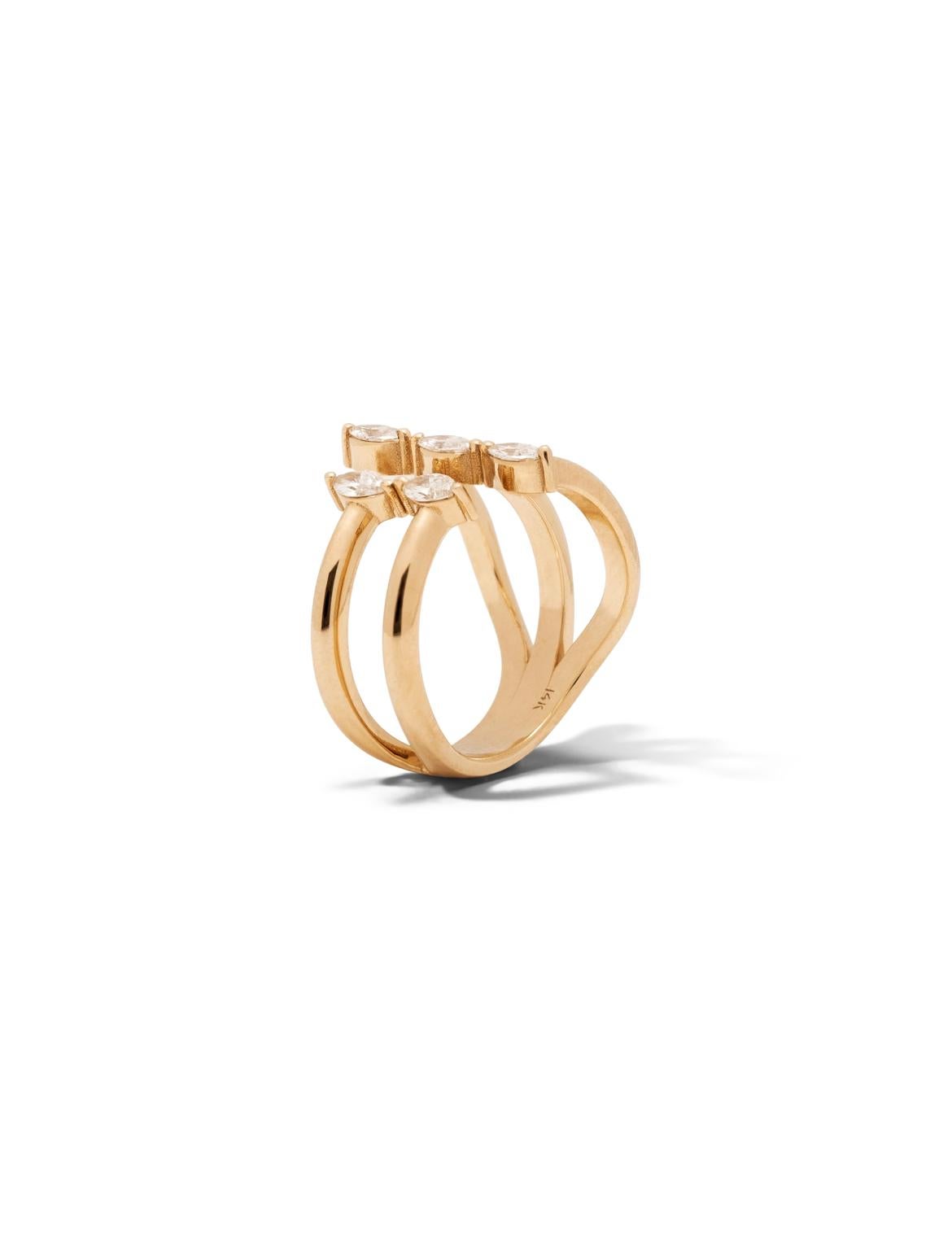 Asymmetry has never looked this perfect. The open ring design features marquise cut diamonds set in brilliant 14K gold. The ring bands elegantly converge together to the back. This handcrafted beauty will magnificently adorn your hand and take your