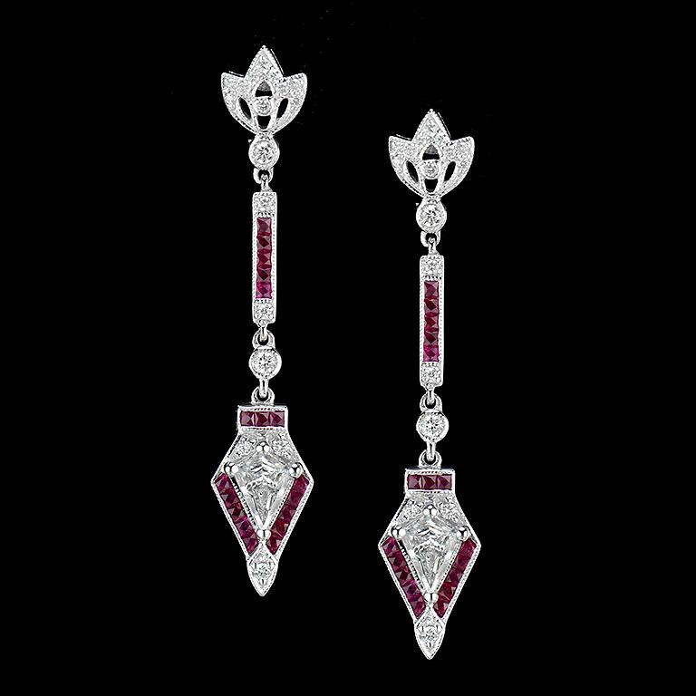 18K W/G Earrings with Ruby and Diamond.
Art Deco style Earrings were made in 18K White Gold, set with a pair of special Kite Diamond (E color VVS Clarity 2 pcs. 0.6 ct.), French Cut Ruby 1.3 ct. and the twinkling of tiny Diamond 0.38 ct.
Weight 6.42