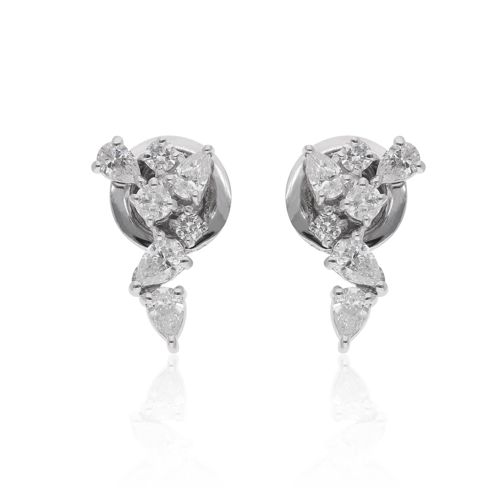 Immerse yourself in the enchanting beauty of these meticulously crafted diamond stud earrings, each a masterpiece of artistry and elegance. Fashioned from the finest 18 karat white gold and adorned with a captivating combination of pear and round