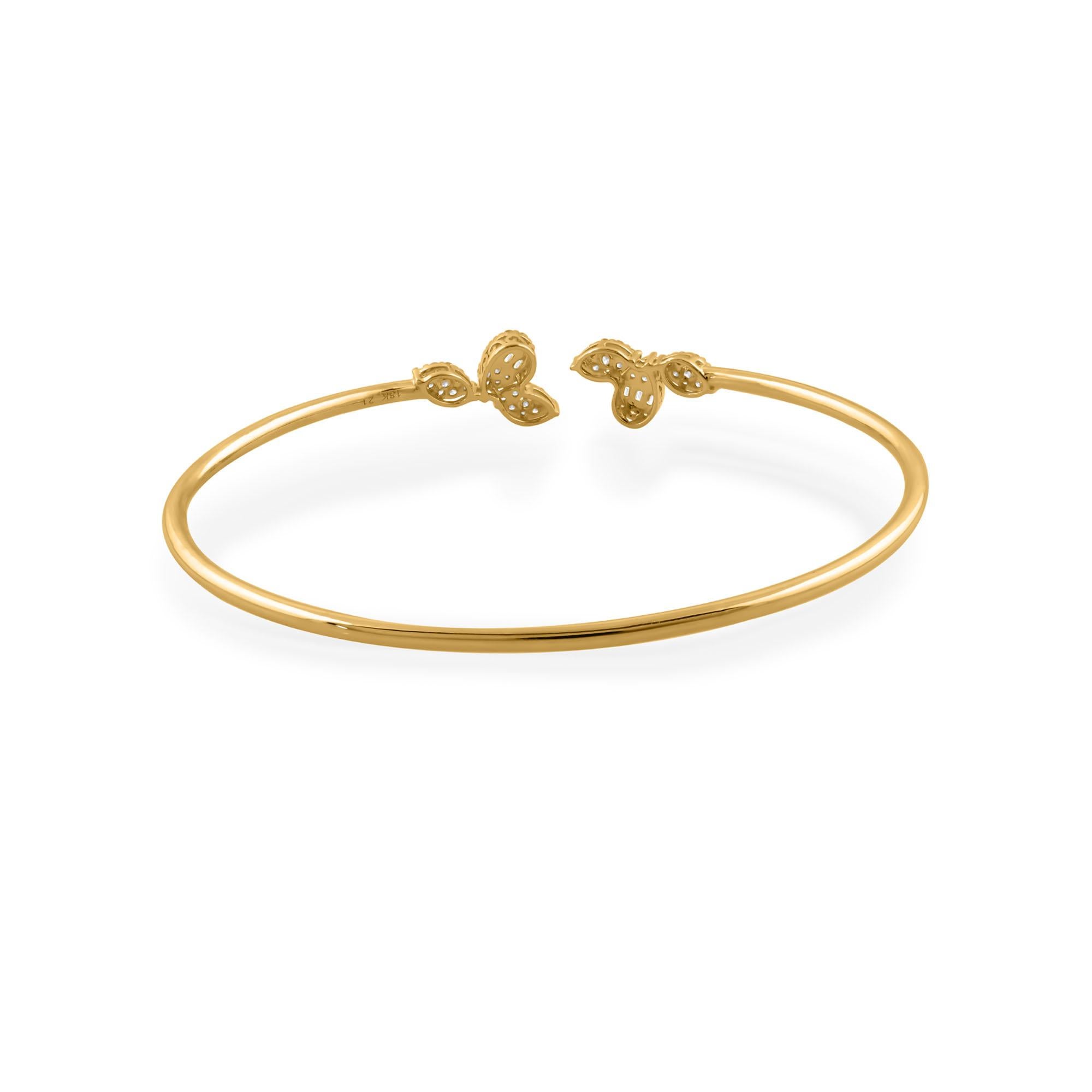 Step into the world of refined elegance with this captivating 0.60 Carat Baguette Diamond Cuff Bangle Bracelet, a stunning piece of jewelry meticulously crafted in luxurious 14 Karat Yellow Gold. Embodying sophistication and grace, this bracelet is