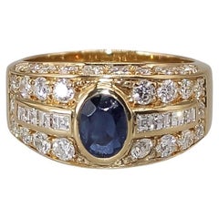 0.60 Carat Central Natural Sapphire and Diamonds on an 18 Karat Yellow Gold Ring
