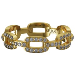 Anillo con banda de diamantes de 0,60 quilates y oro amarillo de 18 quilates