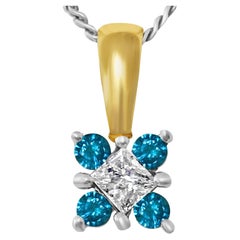 Pendentif en or 14 carats avec diamants de 0,60 carat et diamant bleu.