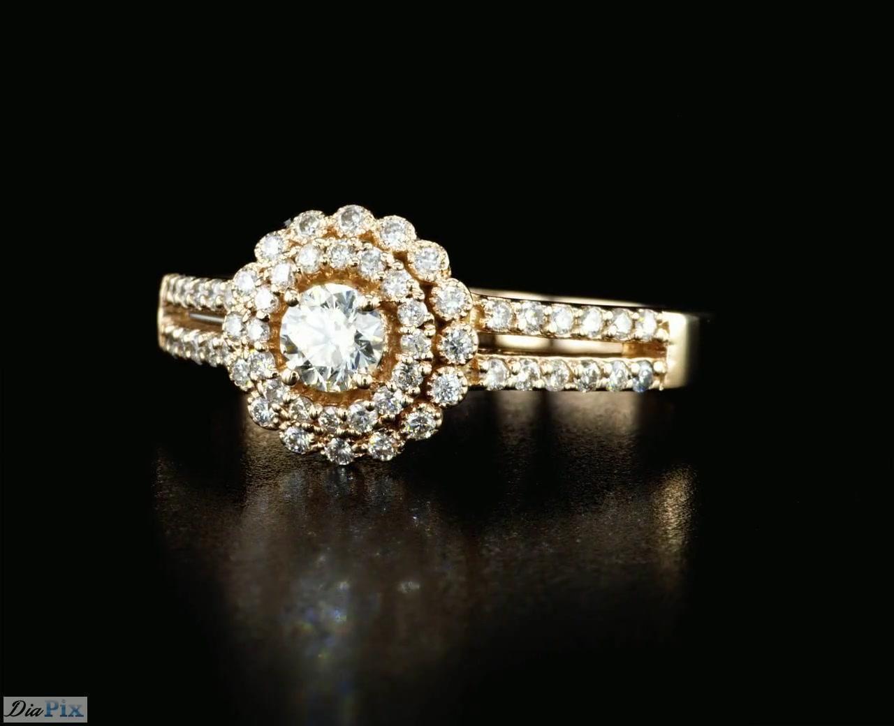 Handcrafted Diamond and Rose gold ring with 0.60 Total Diamond Weight.
This timeless ring is set with high quality 0.25 Carat round brilliant diamond E-G/ VS and surrounded by 56 side diamonds 0.35 Carat total weight mounted on 14K rose  gold.