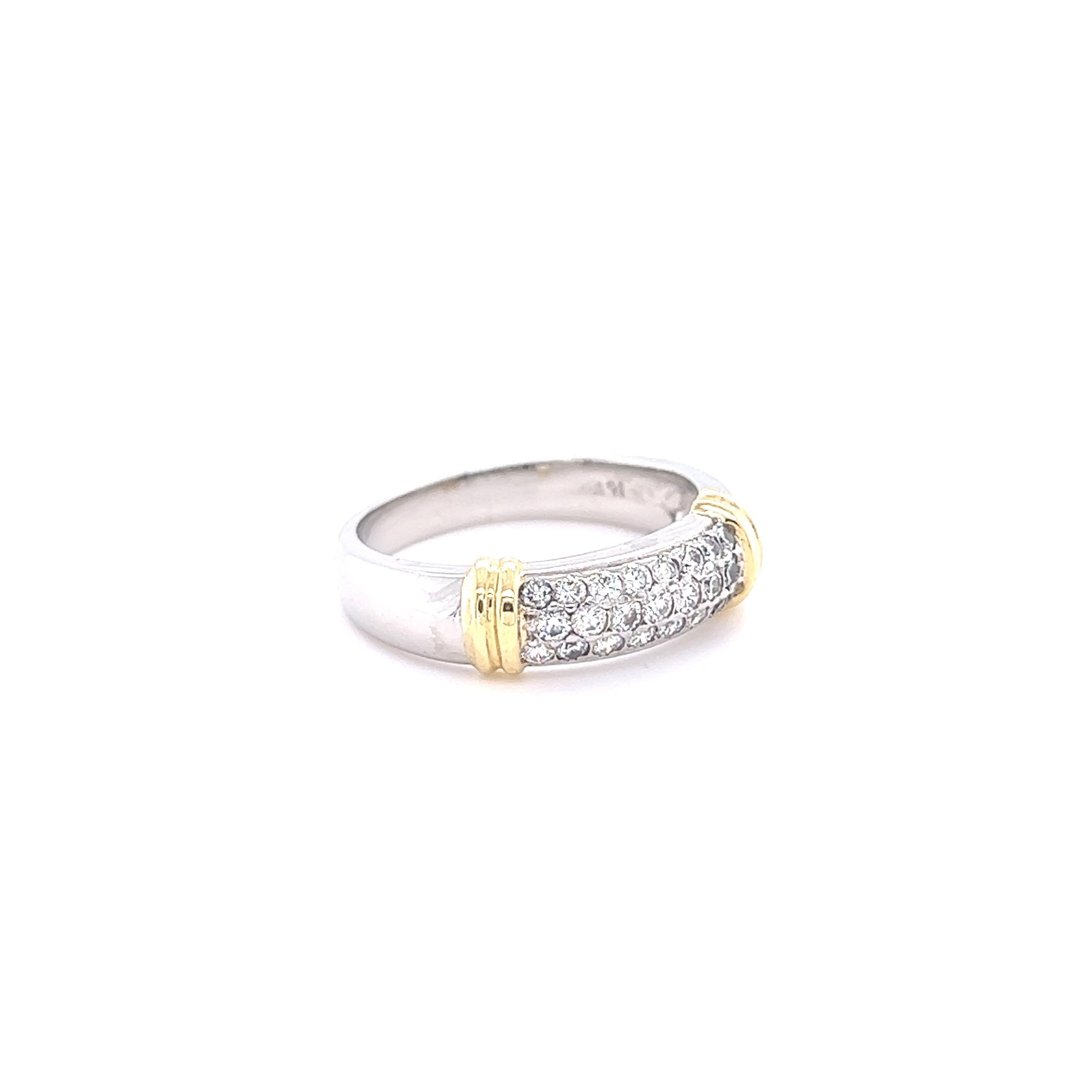 This band has 22 Round Cut Diamonds that weigh 0.60 carats. The clarity and color of the diamonds are SI-F. The band is 5.5 mm in thickness. 

The band is curated in Platinum and 18K and weighs approximately 9.1 grams. 

The ring is a size 8 1/2 and