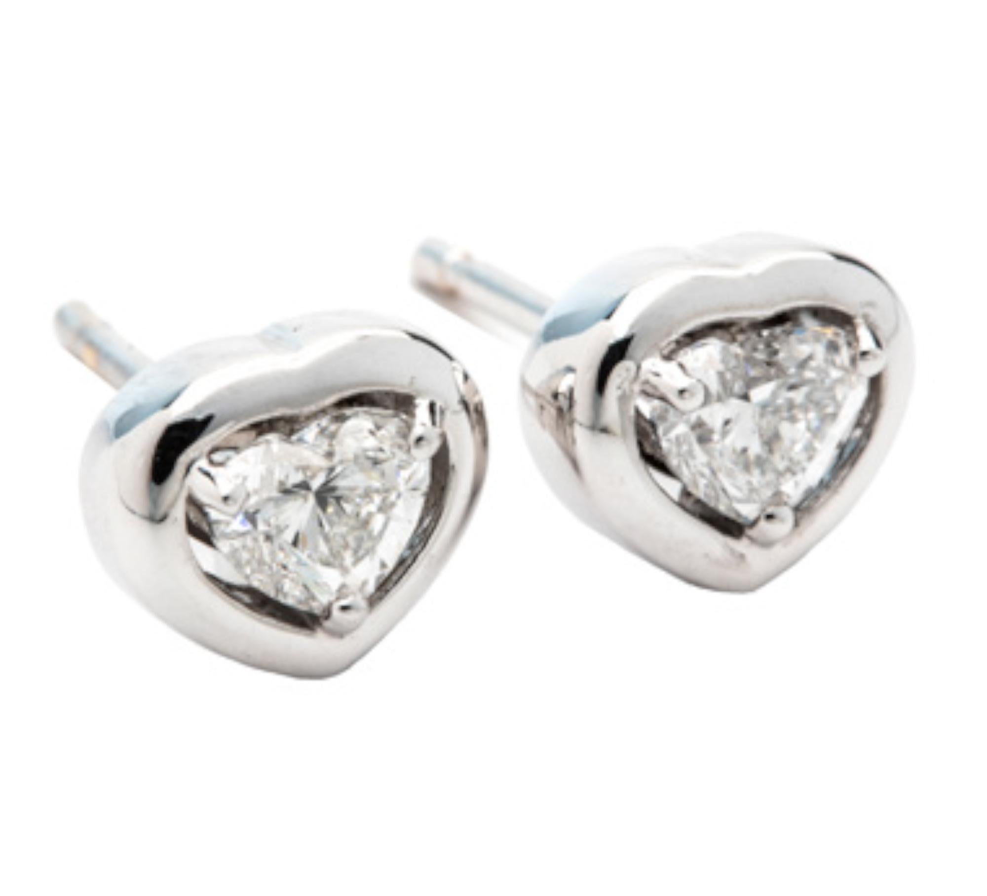 Unlock the depths of romance and elegance with our 0.60 Carat E-F Color VS Heart Cut Diamond 18K White Gold Stud Earrings. These enchanting earrings are a testament to love's enduring beauty, captured in every facet.

Crafted in the finest 18K white