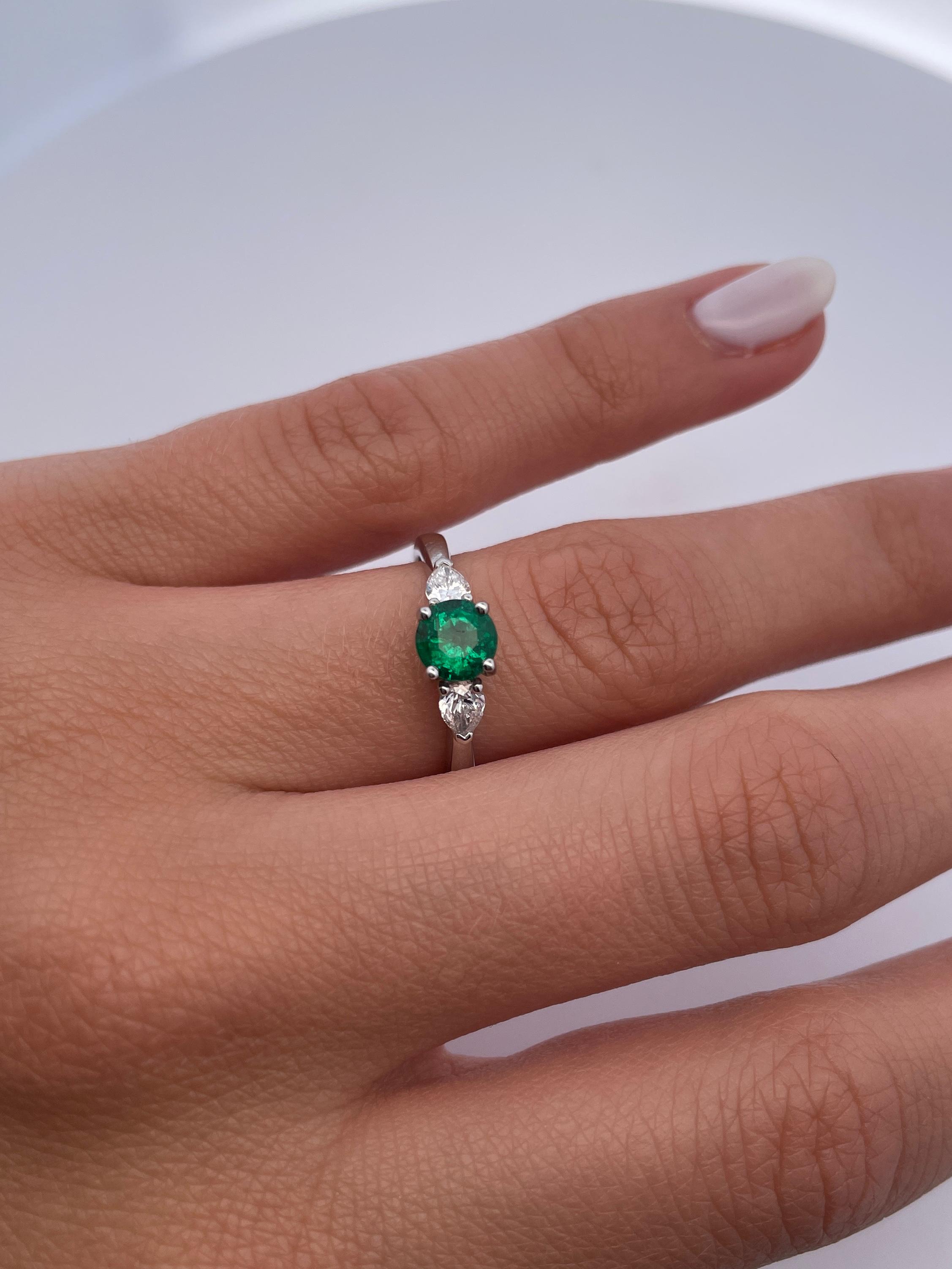 Round Cut 0.60 Carat Emerald and Diamond Three Stone Platinum Engagement Ring For Sale
