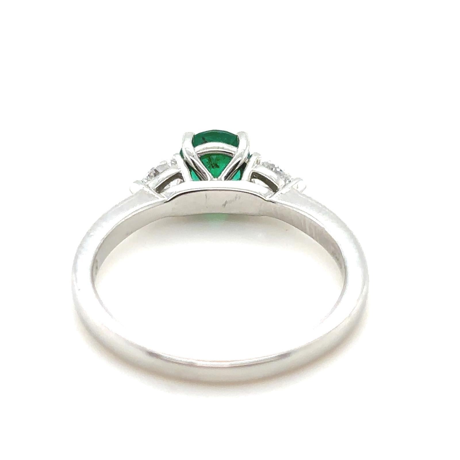 0.60 Carat Emerald and Diamond Three Stone Platinum Engagement Ring In Excellent Condition For Sale In London, GB