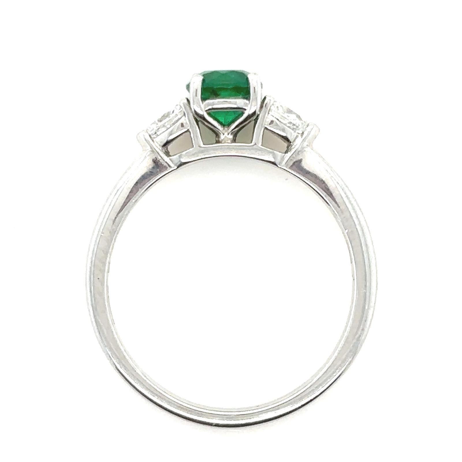 Women's 0.60 Carat Emerald and Diamond Three Stone Platinum Engagement Ring For Sale