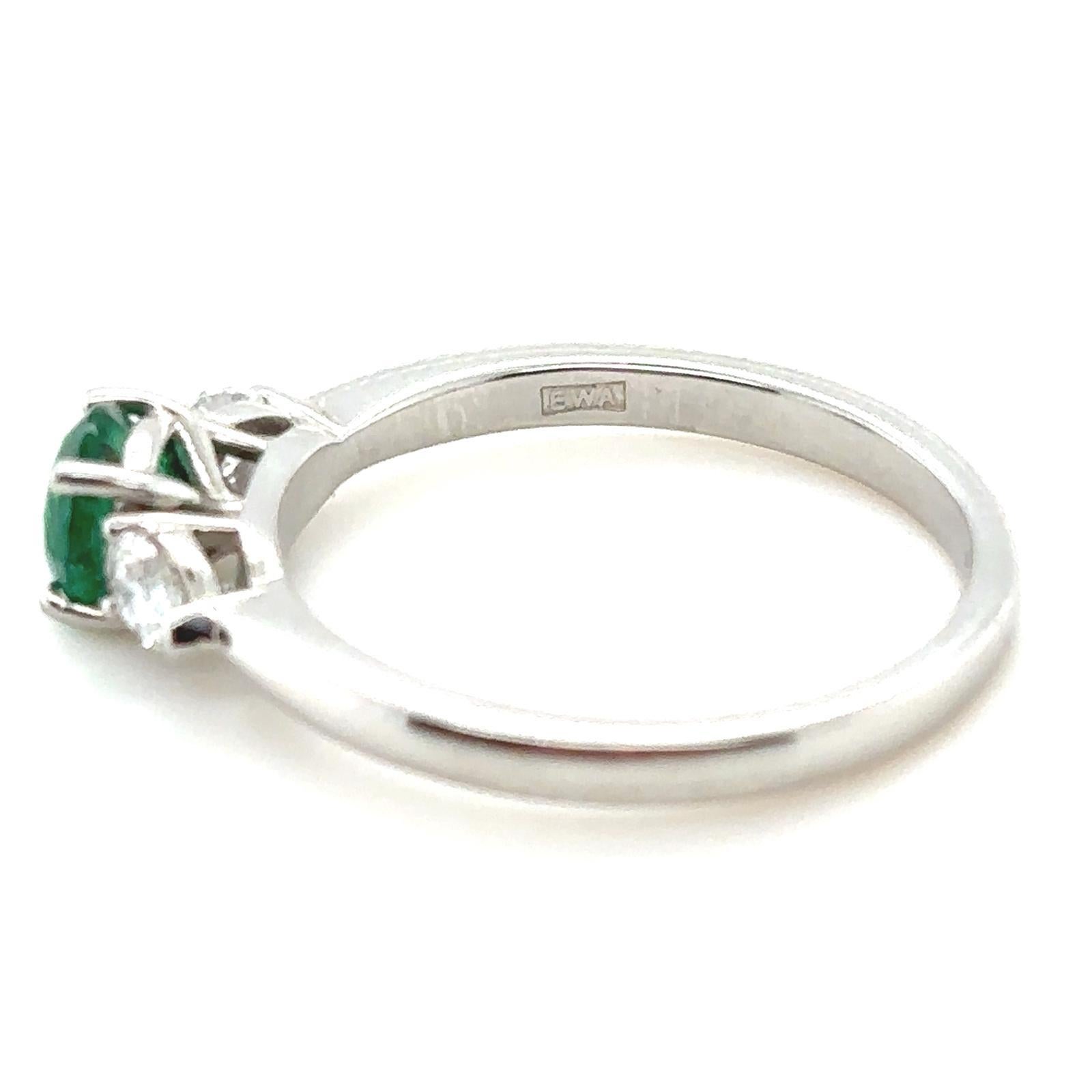 0.60 Carat Emerald and Diamond Three Stone Platinum Engagement Ring For Sale 1