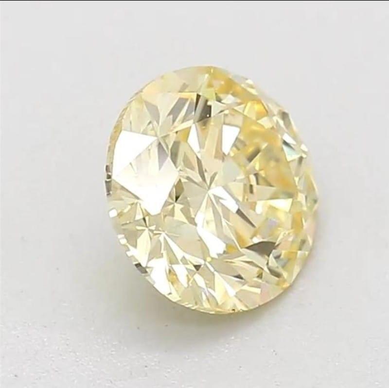 Women's or Men's 0.60 Carat Fancy Yellow Round cut diamond SI1 Clarity GIA Certified For Sale