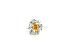0.60 Carat GIA Certified Fancy Vivid Yellow-Orange Diamond and Diamond Ring