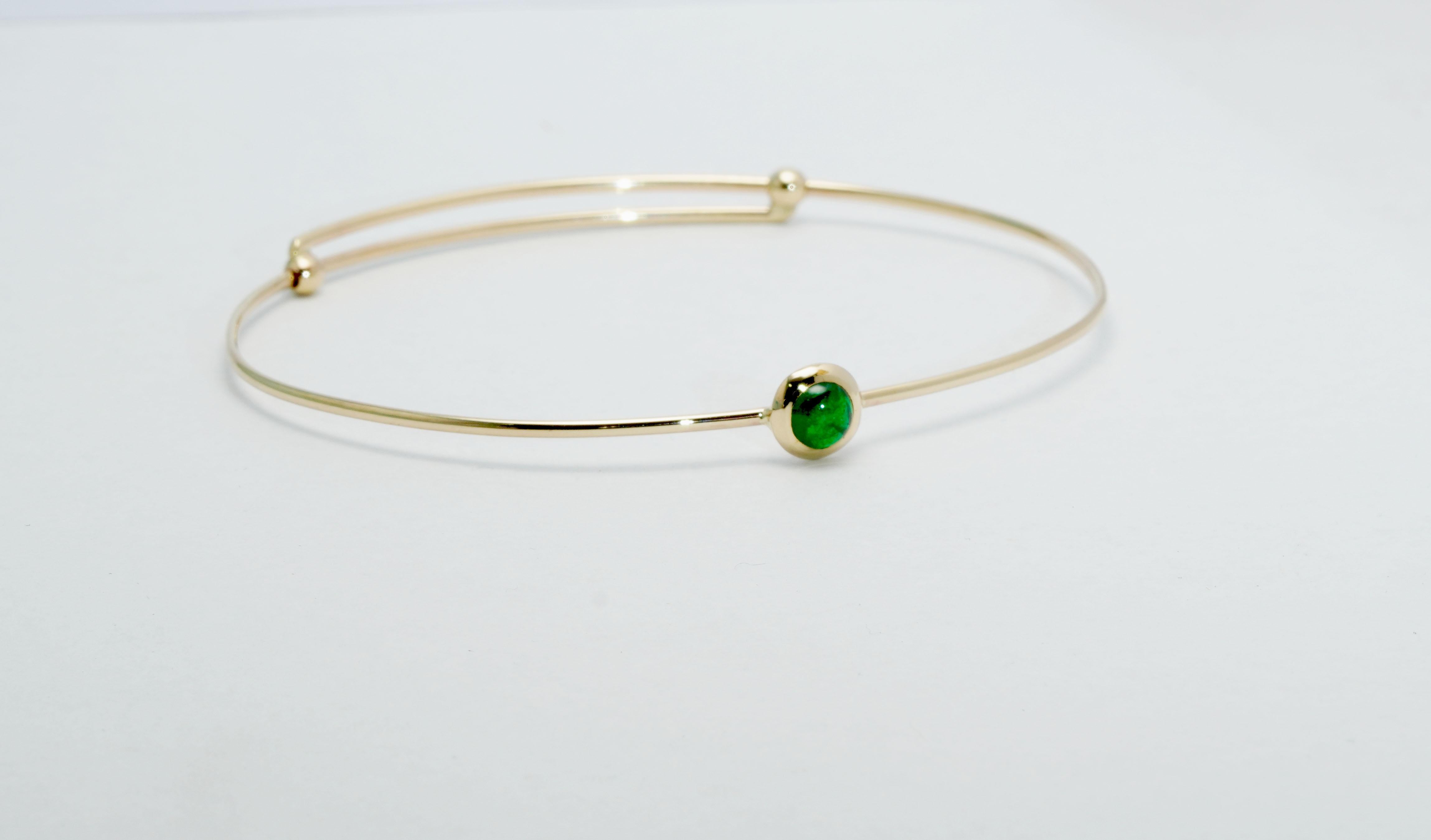 A stunning 14 ct. Yellow Gold Bracelet set with Green Tsavorite. The Bracelet is stretchable when put on.
Gold color: Yellow
Dimensions: 60mm. x 50mm. 
Total weight: 3.26 grams 

Set with:
- Green Tsavorite
Cut: Cabochon
Weight:  0.60 Carat
Color: