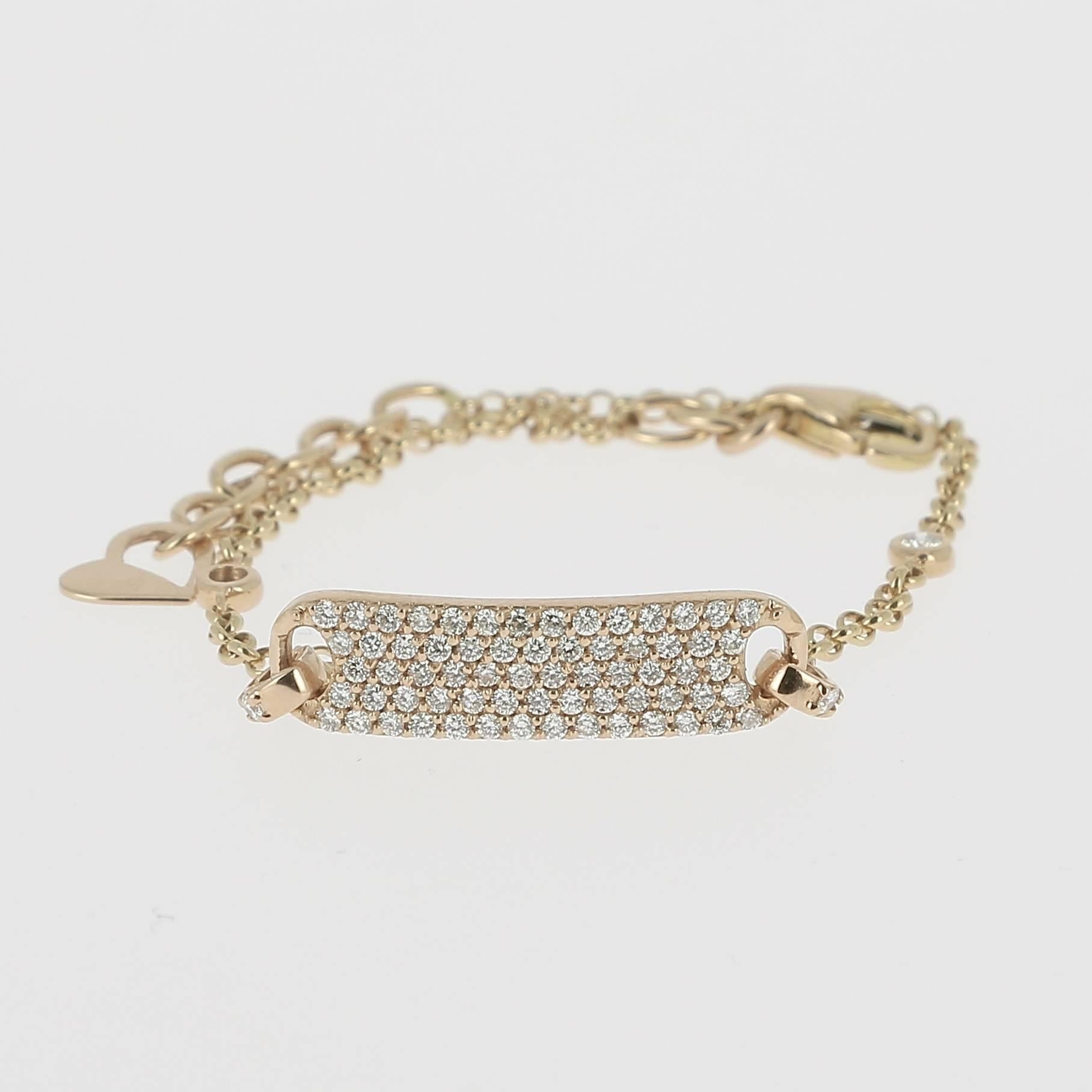 An amazing Tag Bracelet paved with Round Diamonds weighing 0.60 carats, hanging on a Chain Bracelet
The Clasp Necklace have several links to adjust the size on the wrist.
The Bracelet is available in 18K Yellow Gold, 18K Rose Gold and 18K White