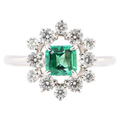 0.60 Carat Natural Emerald and Diamond Engagement Ring Set in Platinum