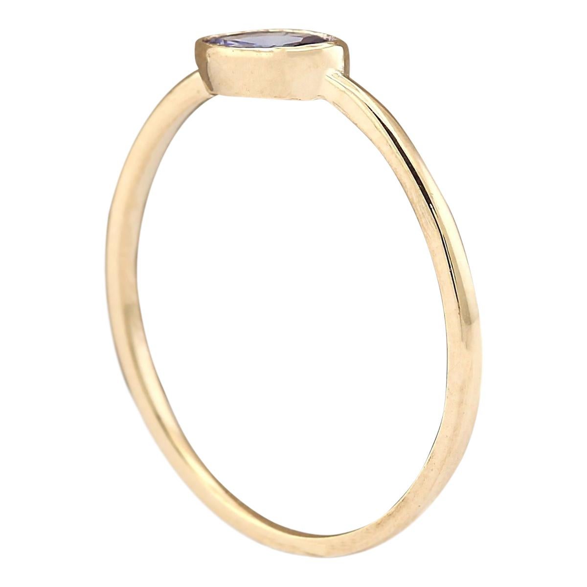 Oval Cut 0.60 Carat Natural Tanzanite 14 Karat Yellow Gold Ring For Sale