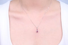 0.55 Carat Oval Cut Ruby Diamond Accents 10K White Gold Pendant