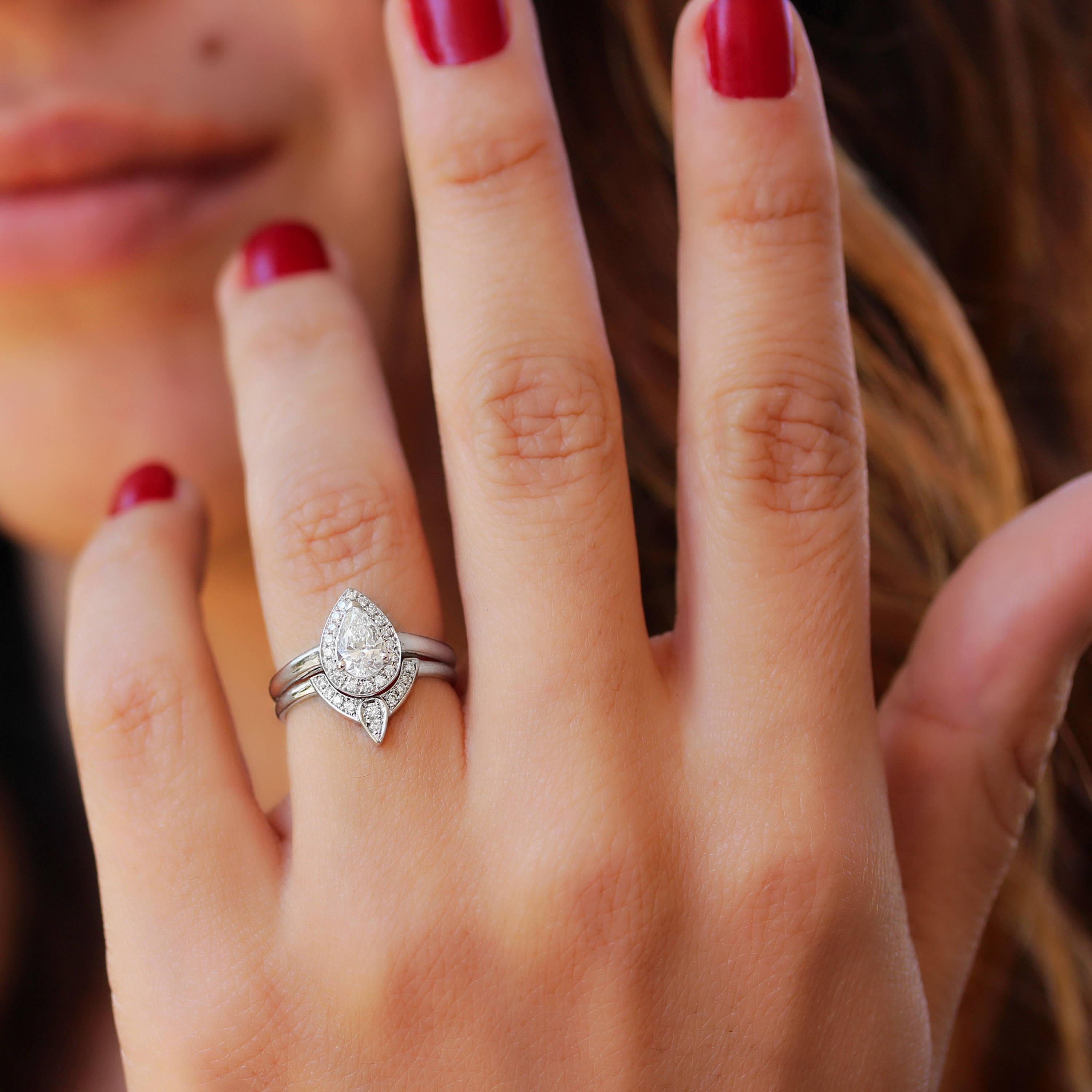 Beautiful pear diamond wedding two-ring set - The 3rd Eye.
The center stones can be customized.
This list is for two ring set.
Handmade with care. 
An original design by Silly Shiny Diamonds. 

Details: 
* Center Stone Shape: Pear shape. 
* Center