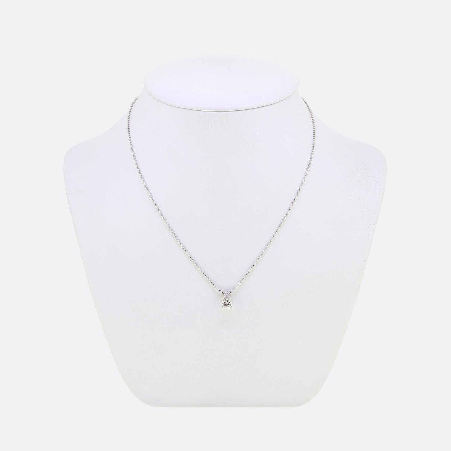 Here we have a solitaire diamond necklace. The pendant features a single princess cut diamond that has been set within a four clawed mount and suspended from a matching 18ct white gold beaded chain. 

Condition: Used (Very Good)
Weight: 3.6