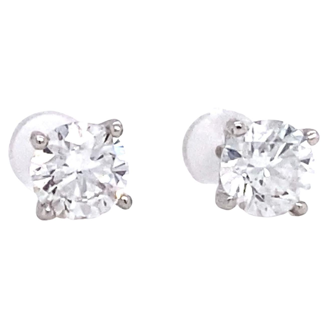 Clous d'oreilles en or blanc 14 carats avec diamants ronds de 0,60 carat