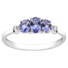 Vintage 0.60 Carat Tanzanite Oval Cut and Diamond 10K White Gold Bridal Ring