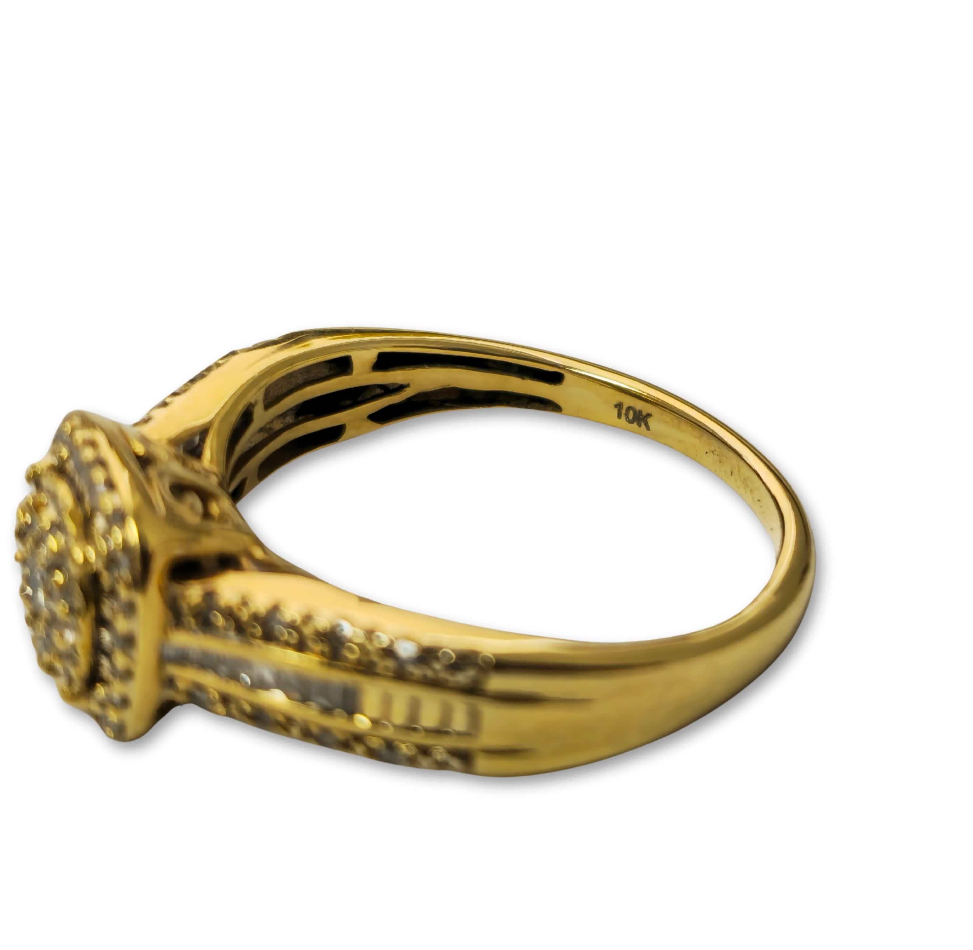 Crafted from gleaming 10k yellow gold, this elegant wedding ring is adorned with a total of 0.60 carats of natural, earth-mined diamonds, featuring a mix of round and baguette cuts. With diamonds of I2 clarity and G color, this ring exudes sparkle