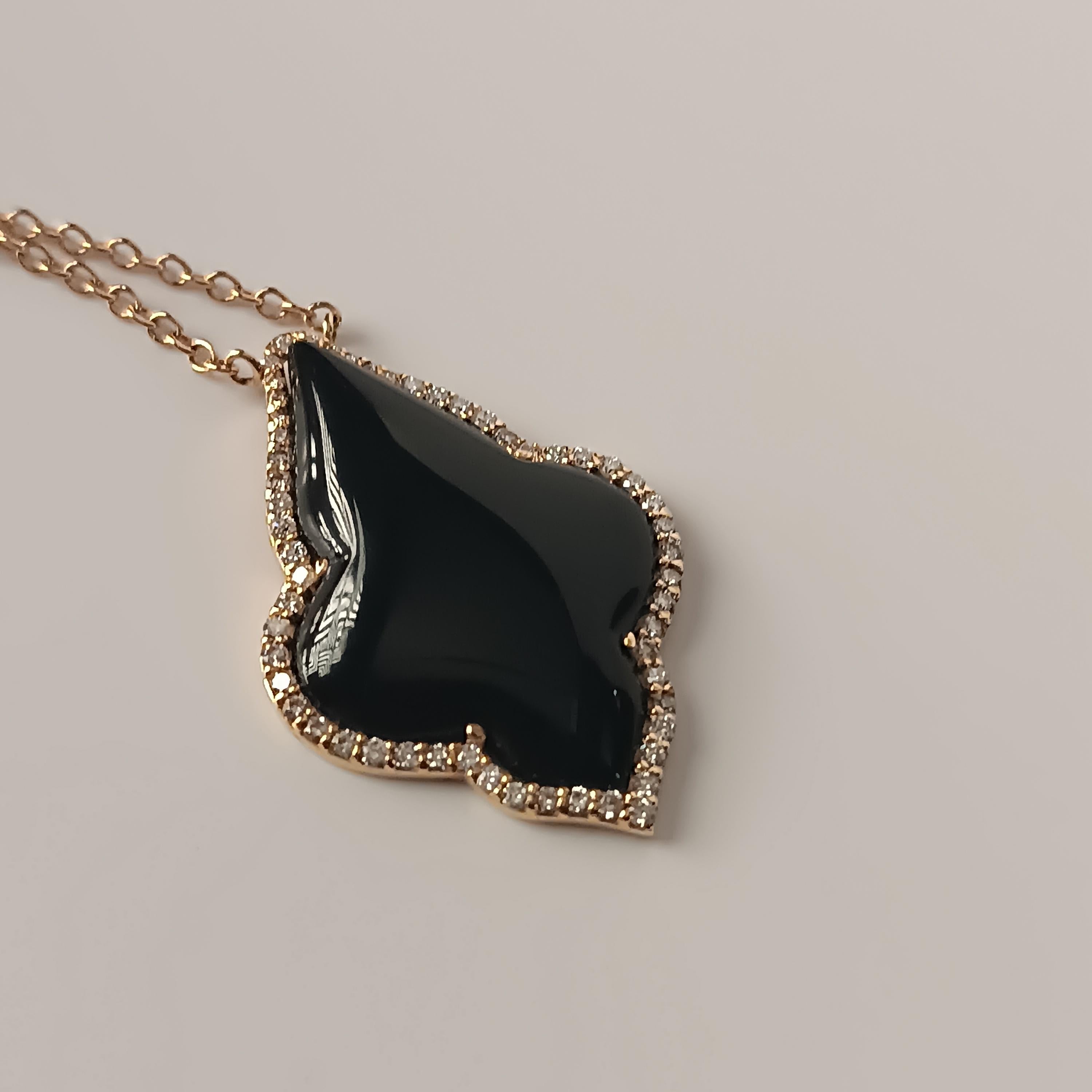 This wonderful Leo Milano pendant from our Carrobbio collection shows in every detail a very complicate yet perfectly done workmanship. The pendant and the chain are in 18 carat rose gold with onyx . The object weights 8,85 grams the total diamonds 