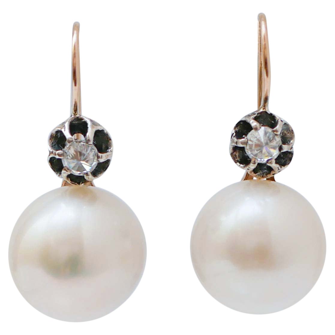Boucles d'oreilles en or rose et argent, diamants de 0,60 ct, perles de 16 mm.