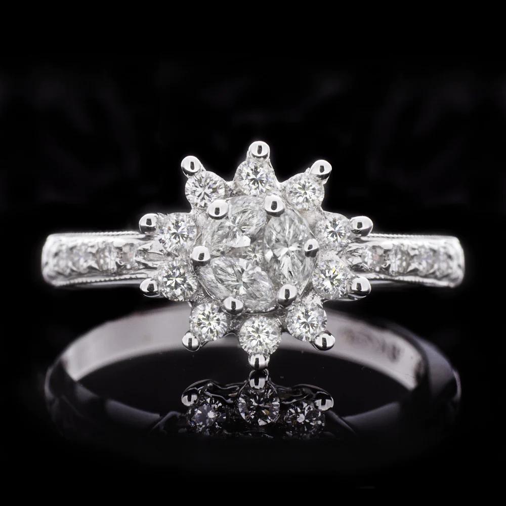 The cluster center creates the illusion of a large center stone surrounded by a halo for a large look.
The cluster is made up of marquise diamonds, which is very an unusual to find.
This Ring has a beautiful Big look, with colorless and eye clean