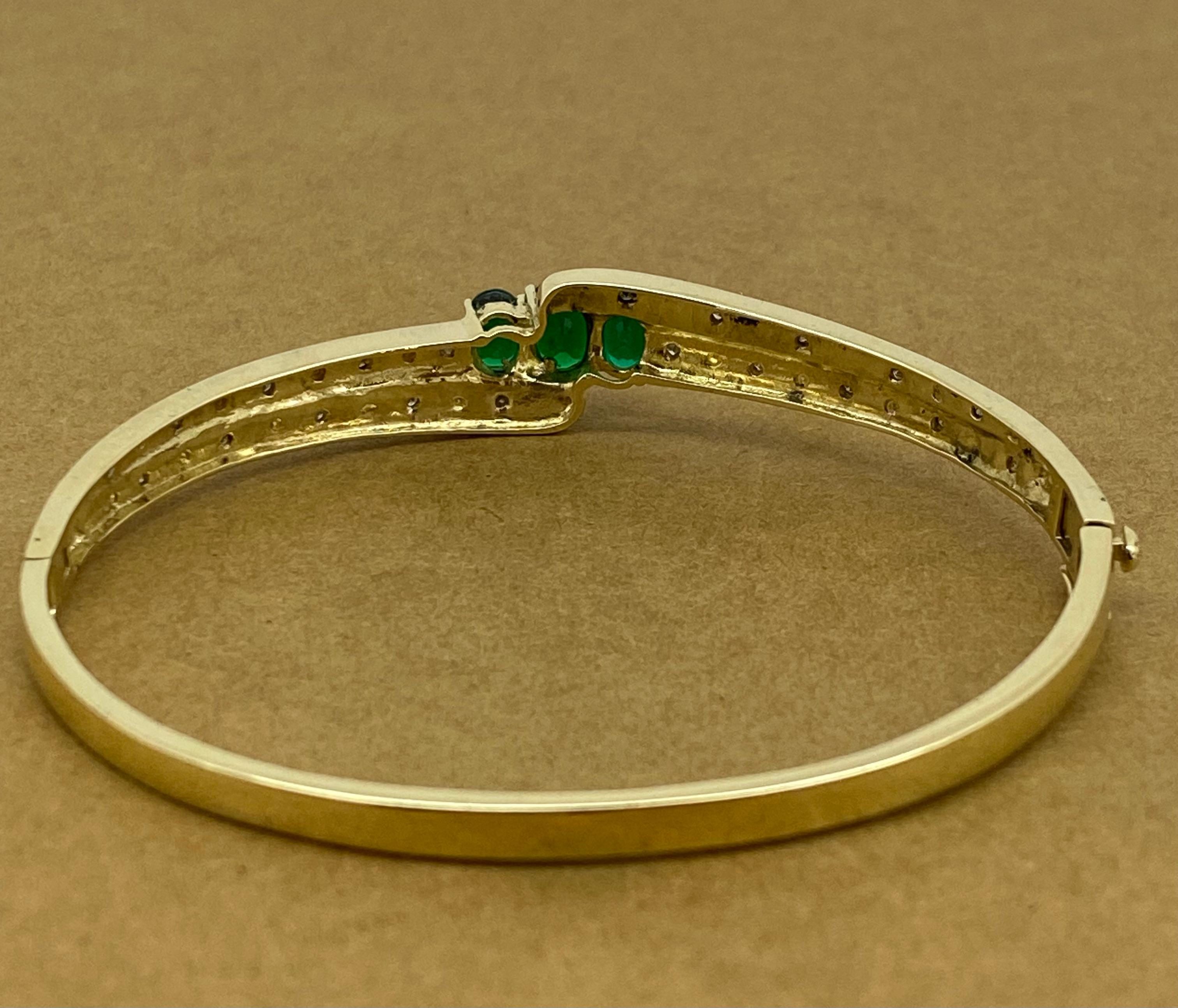 0.60ct Diamond, 2.00ct Gilson Emerald, 9K Yellow Gold Vintage Bangle, 19cm -7.5