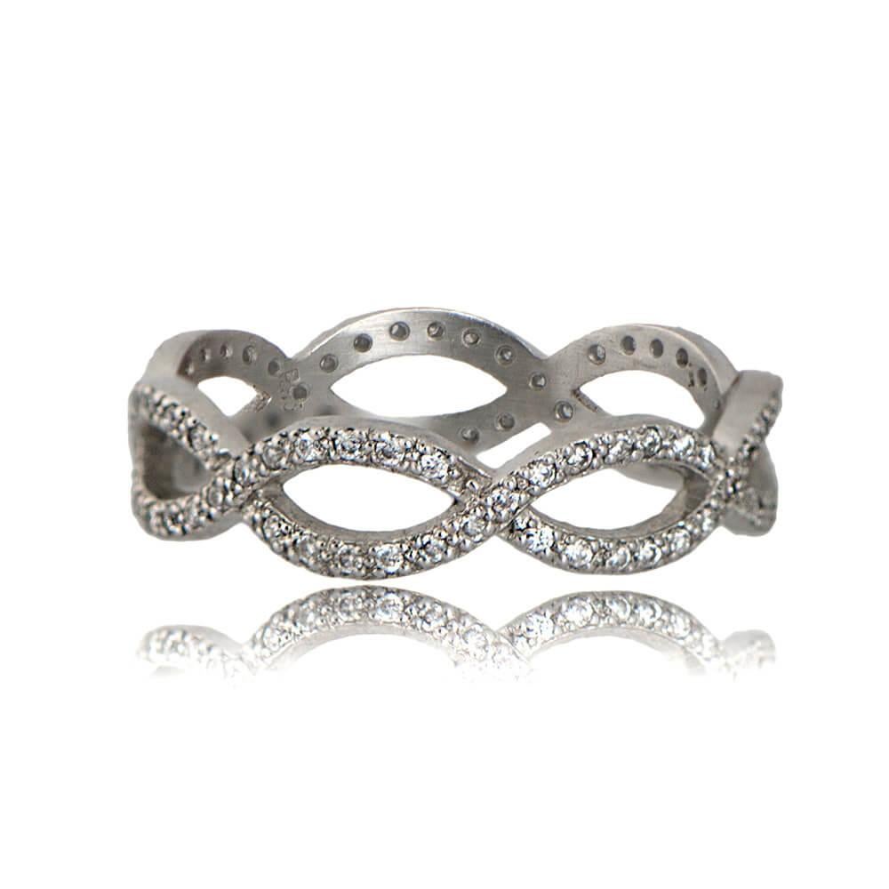 A graceful platinum band featuring two interweaving rows of meticulously micropavé-set diamonds. The diamonds, with an approximate H-I color and VS clarity, collectively weigh around 0.60 carats. This vintage-inspired infinity band exudes timeless
