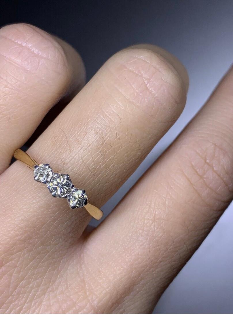 0.60ct Diamond chunky trilogy engagement ring 18ct yellow gold
0.60ct Round diamond trilogy engagement ring in 18k yellow gold.

Classic three diamond ring trilogy engagement ring in plain 18k yellow and white gold band.

Hallmarked

Claw 18k white
