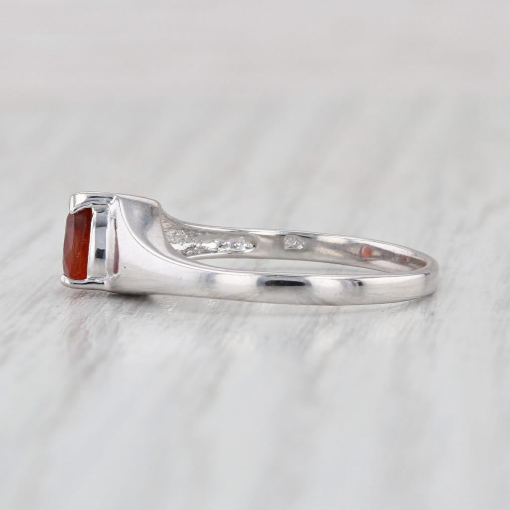 Gemstone Information:
- Natural Tourmaline -
Carats - 0.60ct 
Cut - Pear
Color - Orange

Metal: 14k White Gold
Weight: 2.8 Grams 
Stamps: 14k
Face Height: 6.4 mm 
Rise Above Finger: 6.3 mm
Band / Shank Width: 2 mm

This ring is a size 7, but it can