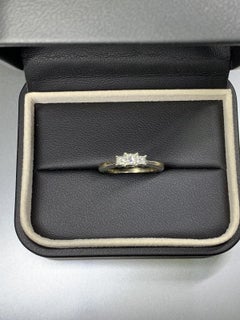 0.60ct Princess diamond trilogy engagement ring in 18k white gold.