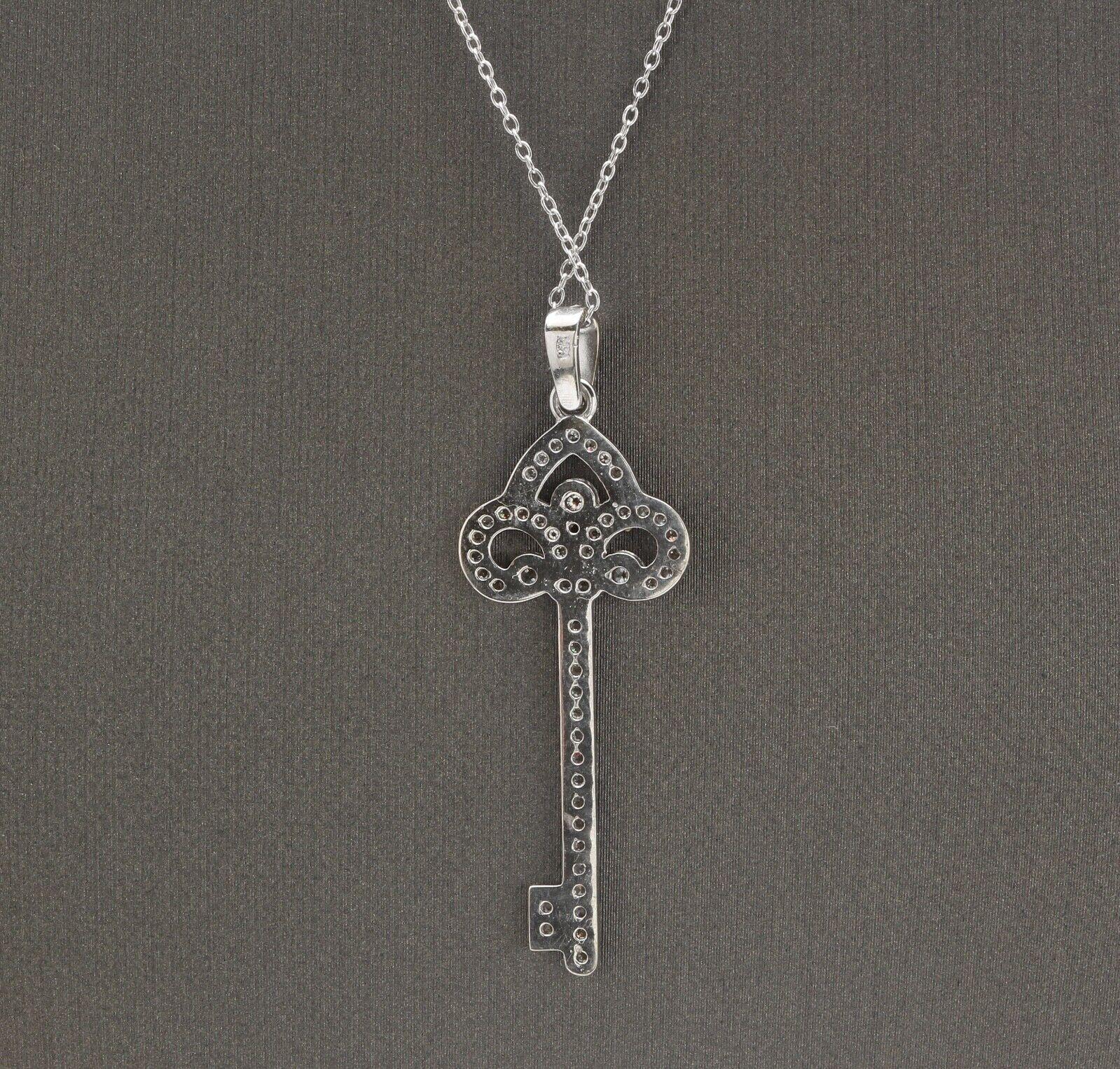 0.60Ct Splendid 14k Solid White Gold Key Pendant Necklace

Amazing looking piece! 

Stamped: 14k

Total Natural Round Diamond Weight is: Approx. 0.60 Carats (G-H / SI)

Chain Length is: 18 inches (can adjusted to 16