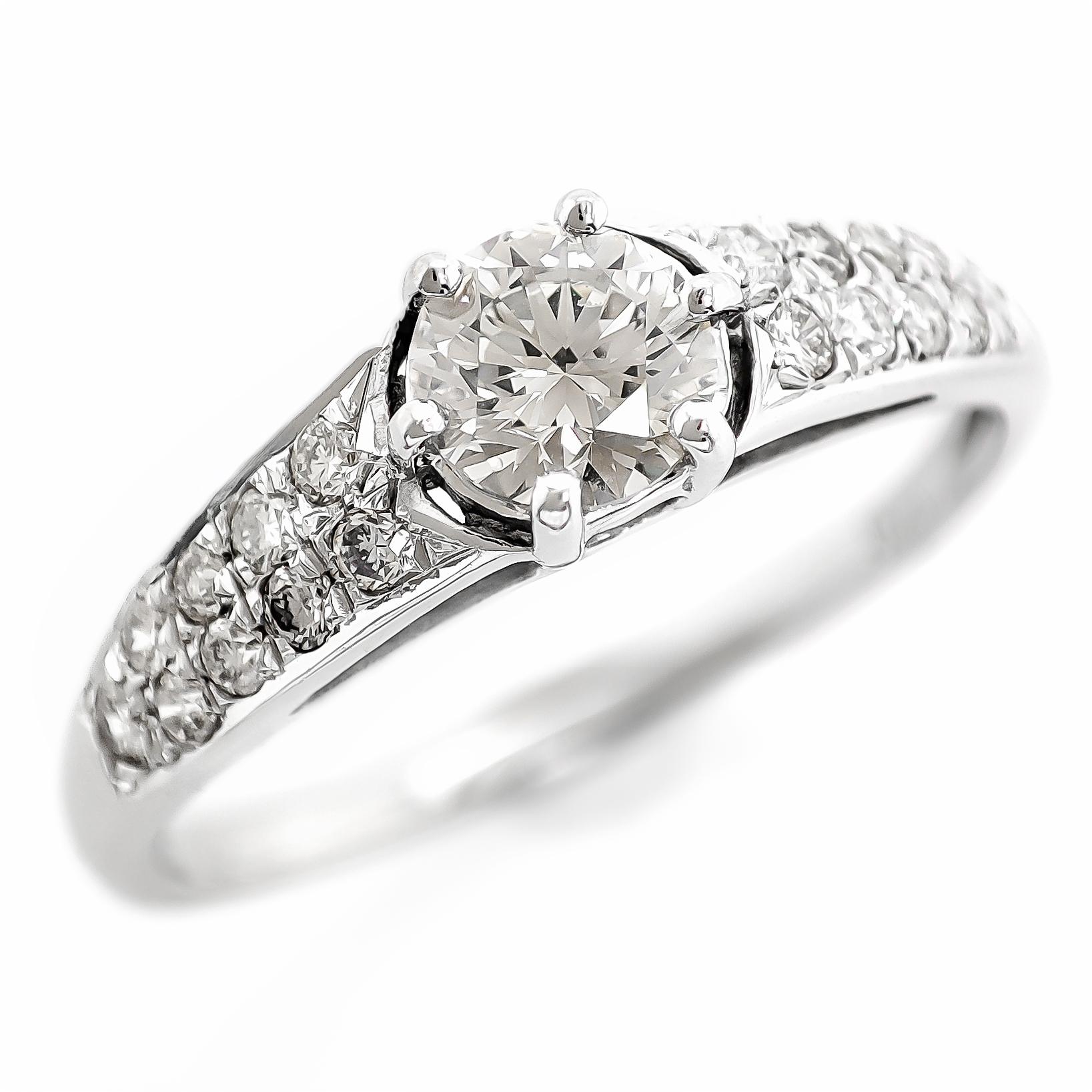 FOR US CUSTOMER NO VAT!

You've described a 0.60 carat total weight (CTW) round diamond ring set in 14K white gold. The central diamond in this elegant ring weighs 0.42 carats and has a color grade of K and a clarity grade of VS1, indicating a warm