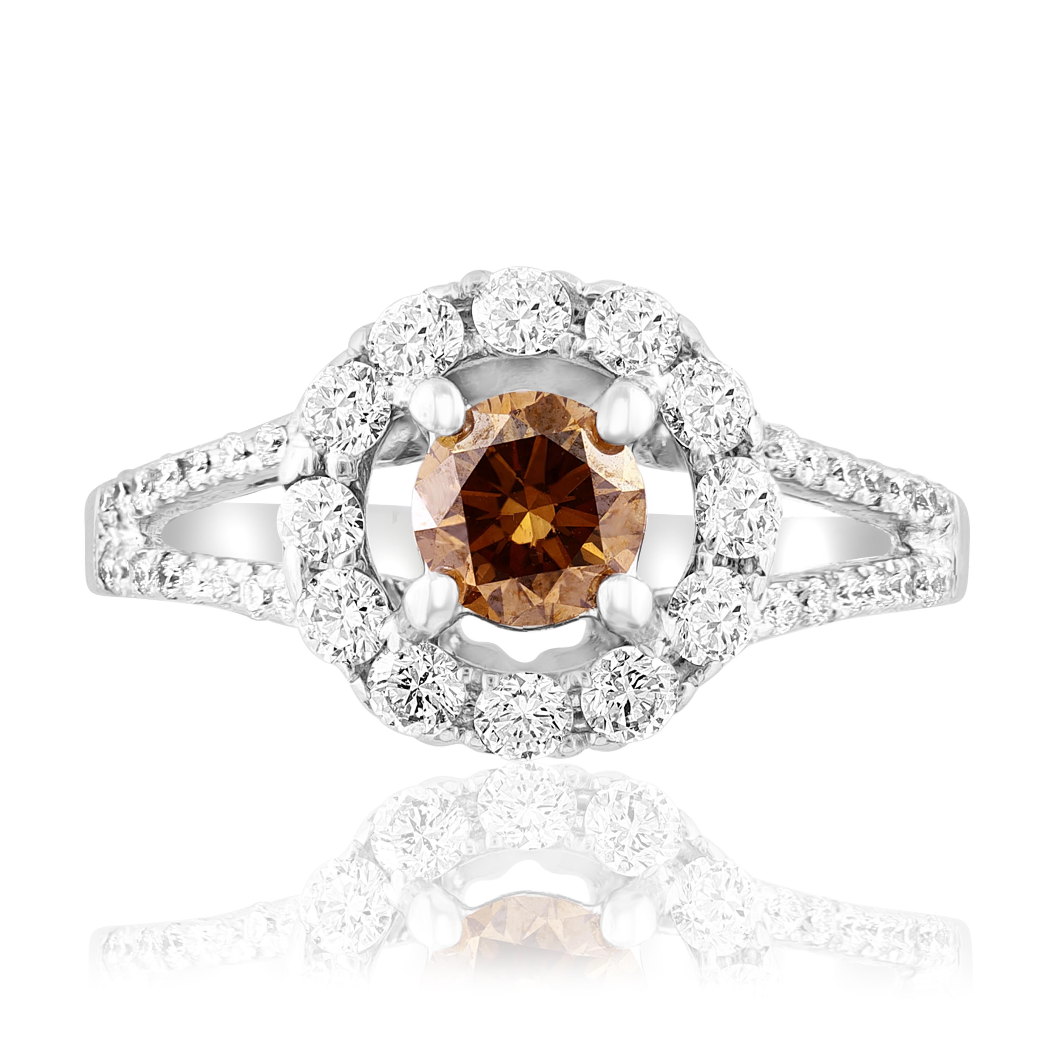 This classic Brilliant Cut Fancy Brown Diamond is 0.61 Carat. Brown Diamond as its center and is surrounded by 12 Round Cut Diamonds in 18K White Gold.