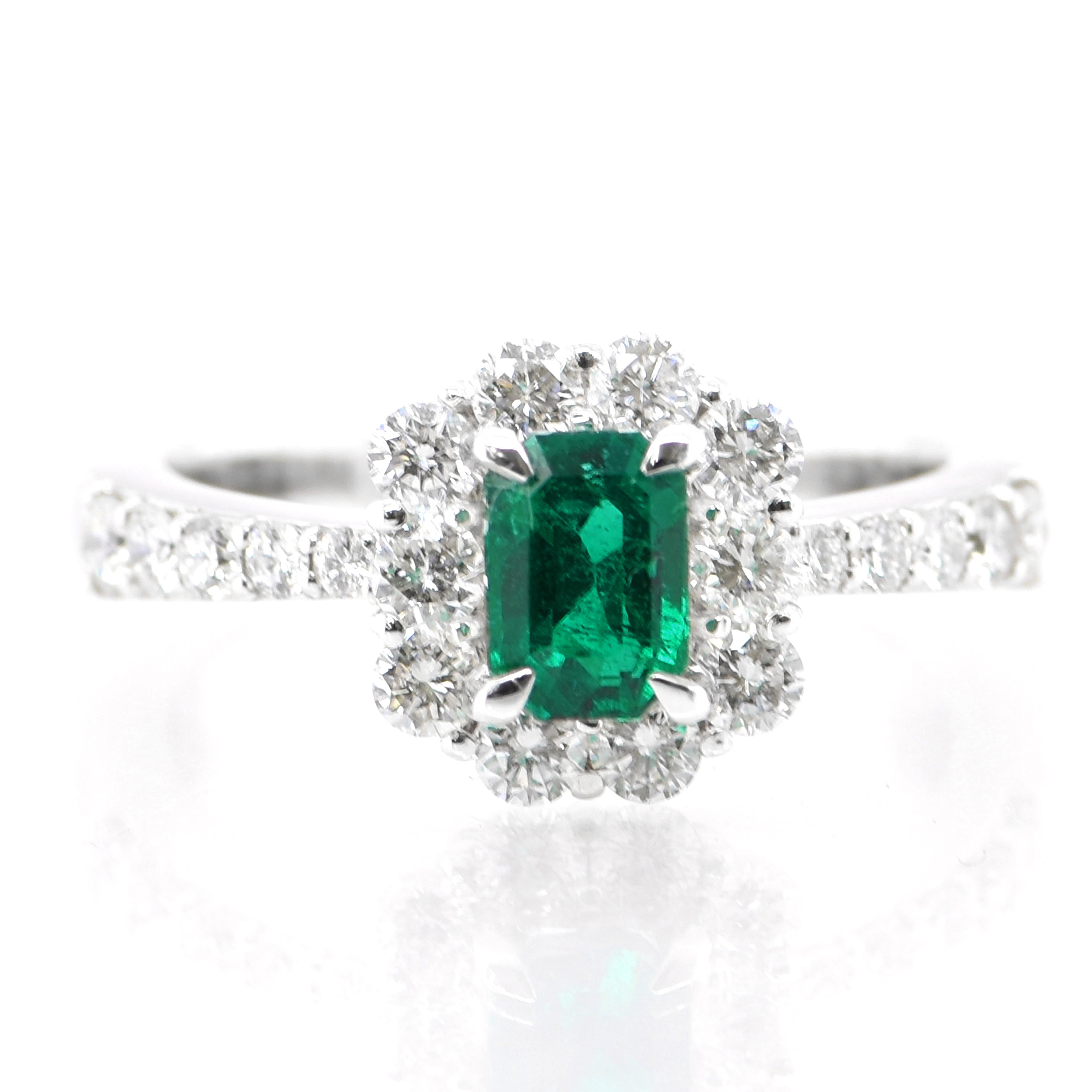 0.61 Carat Natural Vivid Green Emerald and Diamond Ring Set in Platinum
