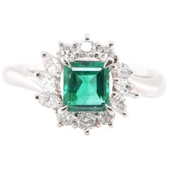 0.61 Carat Emerald and Marquise Diamond Halo Ring Set in Platinum