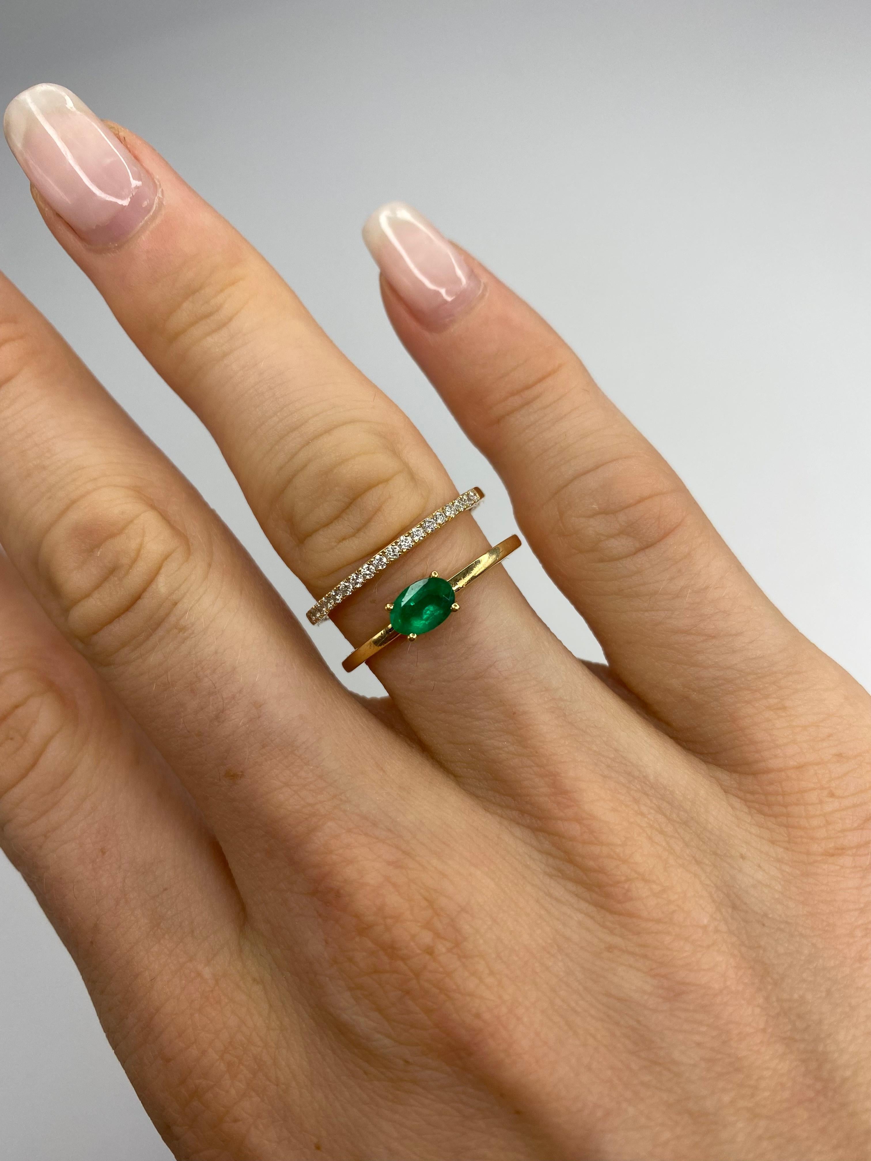 Featuring an oval cut 0.44 Carat Emerald on the right and 19 round diamonds on the left. This design represents traditional aesthetics and beauty that exude nobility. The ring is light weight due to its airy construction but still looks voluminous