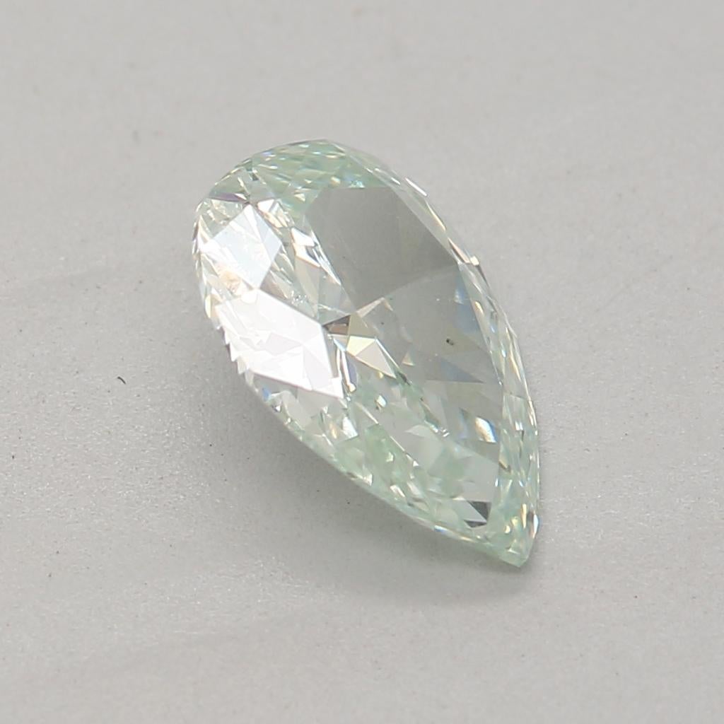 Women's or Men's 0.61 Carat Fancy Bluish Green Pear cut diamond SI1 Clarity GIA Certified For Sale