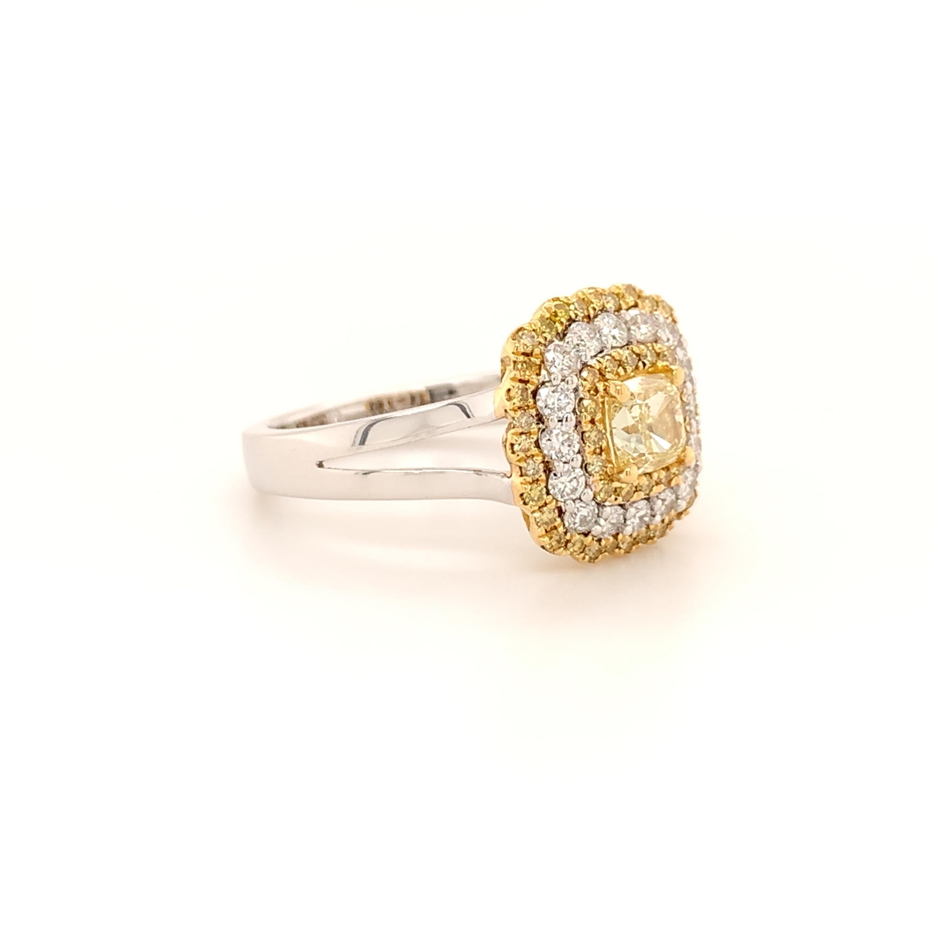 Breathtaking design diamond ring. High brilliance, cushion faceted, 0.61 carat natural fancy yellow diamond encased with four bead prongs, enhanced with fancy yellow diamond and white round brilliant diamond. Handcrafted design set in 18 karat white