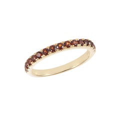 Sunita Nahata Garnet 0.61ct. Eternity Ring in 14Karat Yellow Gold.